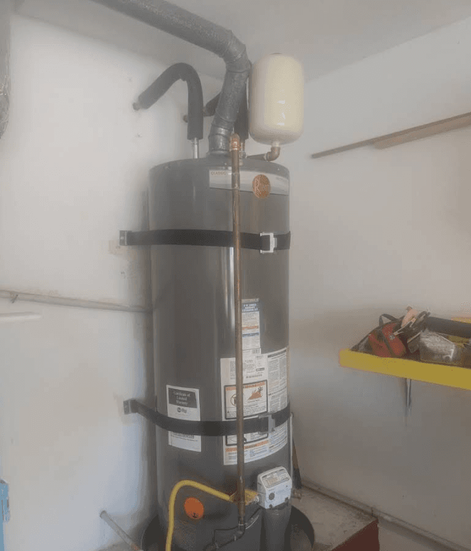 Rheem tank water heater installed with seismic strapping and expansion tank